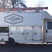 Vehicle signage showing new brand identity applied to Liesgang Building and Remodeling truck