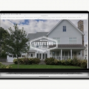 New website design, viewed on laptop, showing beautiful farmhouse image filling the home page with the Liesgang logo overlaid in white